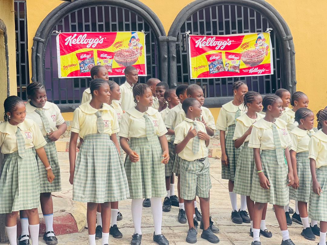 Pupils in school uniform standing for morning assembly