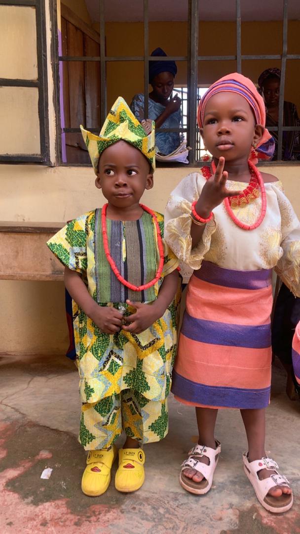 Two younger pupils in traditional Yoruba attire