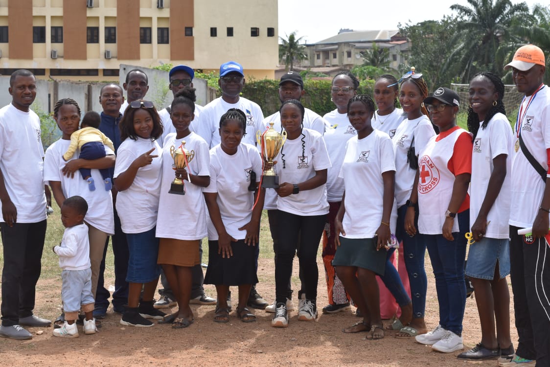 Teaching and administrative staff of Davies Academy on the sports field